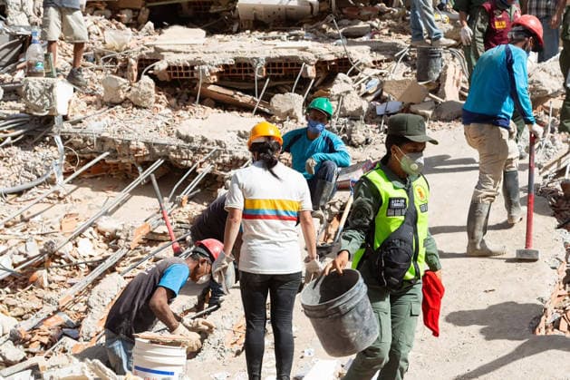 Search and rescue teams continue efforts to locate survivors trapped beneath the rubble of collapsed residential buildings in affected areas following the powerful 7.2‘magnitude earthquake that struck Venezuela and parts of the Caribbean on June 29, 2026. The death toll has risen to over 1,400, with more than 3,000 injured, while authorities report that over 70,000 people remain missing.  VAN2026062921 GovernmentxMinistryxofxInformati