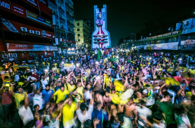 June 30, 2026, Dhaka, Munshiganj, Bangladesh: Thousands of Brazilian football supporters flood the Supermarket Chottor in Munshiganj, Bangladesh, on the night of June 29, 2026, as Brazil secured a 2-1 victory over Japan in the FIFA World Cup 2026 group stage. Despite heavy rain, the crowd Ã¢â‚¬ draped in yellow jerseys and waving green-and-gold flags Ã¢â‚¬ packed every inch of the square, climbing monument structures and rooftops to catch a glimpse of the giant screen. The atmosphere shifted from tense silence to explosive celebration as the final whistle blew, with smoke flares, fireworks, and thousands of raised hands marking one of the most electric football nights in the town s recent memory. Bangladesh has no team in the World Cu - ZUMAa259 20260630_zip_a259_009 Copyright: xRayhanxAhmedx