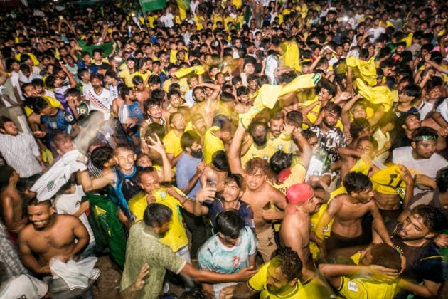 June 30, 2026, Dhaka, Munshiganj, Bangladesh: Thousands of Brazilian football supporters flood the Supermarket Chottor in Munshiganj, Bangladesh, on the night of June 29, 2026, as Brazil secured a 2-1 victory over Japan in the FIFA World Cup 2026 group stage. Despite heavy rain, the crowd Ã¢â‚¬ draped in yellow jerseys and waving green-and-gold flags Ã¢â‚¬ packed every inch of the square, climbing monument structures and rooftops to catch a glimpse of the giant screen. The atmosphere shifted from tense silence to explosive celebration as the final whistle blew, with smoke flares, fireworks, and thousands of raised hands marking one of the most electric football nights in the town s recent memory. Bangladesh has no team in the World Cu - ZUMAa259 20260630_zip_a259_008 Copyright: xRayhanxAhmedx