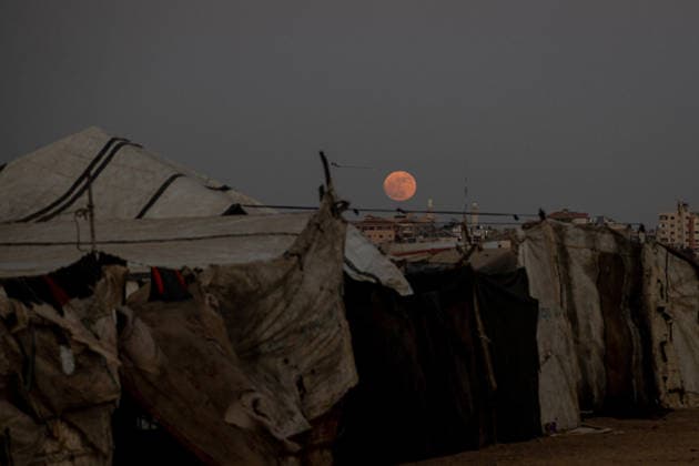 Strawberry Moon in Gaza NUSEIRAT, GAZA, PALESTINE - JUNE 29: The June full moon, also known as the Strawberry Moon, appears in the evening sky over the rubble of buildings destroyed by Israeli attacks in Nuseirat, Gaza, Palestine on June 29, 2026. Abdalhkem Abu Riash Anadolu Nuseirat Gaza. Editorial use only. Please get in touch for any other usage.  Copyright: x2026xAnadoluxAbdalhkemxAbuxRiashx