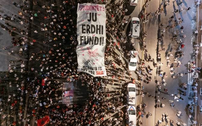 Protests Against Kushner-Linked Development Enter 30th Day in Tirana TIRANA, ALBANIA JUNE 29, 2026: Demonstrators gathered in Tirana during the thirtieth consecutive day of protests against a proposed luxury tourism development project linked to Jared Kushner. Student protesters briefly unfurled a giant banner from the facade of the University of Tirana reading Students: Your Time Is Up alongside the slogan Albania Is Not for Sale before university security removed it. Protesters then marched to the university, where the banner was displayed again following a tense verbal confrontation with security personnel before eventually being taken down and carried through the demonstration. The protest was also attended by several Me Copyright: x xVlasovxSulajx xJNAxPressx