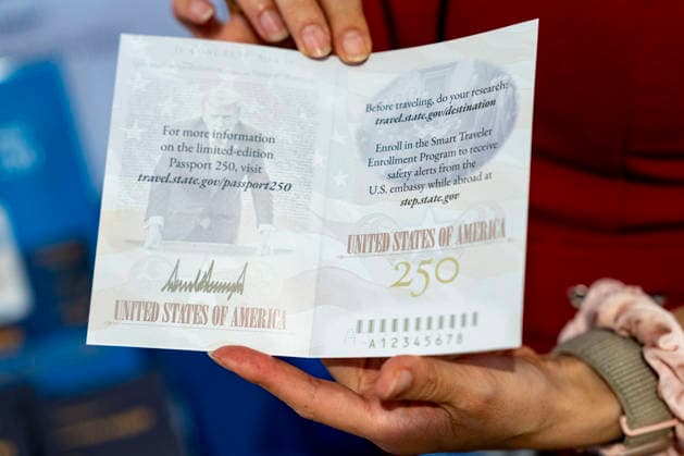 An employee displays an information booklet on the Passport 250 , a limited edition U.S. Passport featuring U.S. President Donald Trump, in the State Department exhibit on the fifth day of the Great American State Fair on the National Mall on Monday, June 29, 2026. The Freedom 250-backed Great American State Fair celebrating the 250th anniversary of the United States runs through July 10th.  WAP20260629427 BONNIExCASH