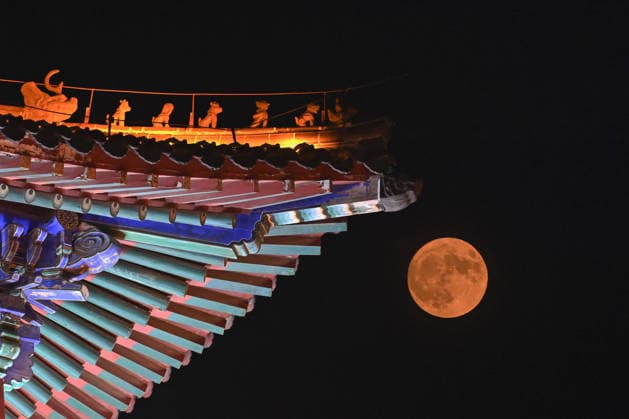 QINGZHOU, CHINA - JUNE 29: (EDITOR S NOTE: Image taken with double exposure) June s full moon, nicknamed the strawberry moon, lights up the night sky on June 29, 2026 in Qingzhou, Shandong Province of China.  Copyright: xVCGx 111651327433