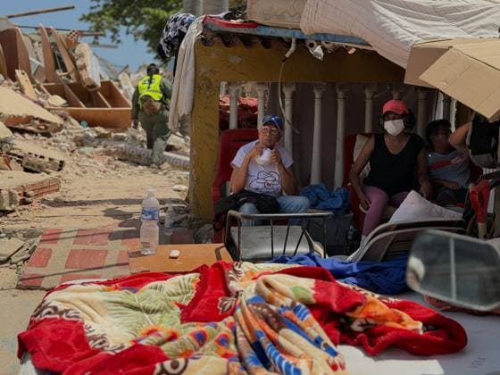 Death toll from Venezuela earthquakes climbs to 1,719 LA GUAIRA, VENEZUELA - JUNE 29: People sit sit in a makeshift shelter following powerful earthquakes in La Guaira, Venezuela on June 29, 2026. The Venezuelan government militarized the state of La Guaira following two earthquakes measuring 7.2 and 7.5 in magnitude with epicenters in Carabobo. The measure aims to coordinate rescue efforts and ensure control and protection for the population. Julio Urribarri Anadolu La Guaira Venezuela. Editorial use only. Please get in touch for any other usage.  Copyright: x2026xAnadoluxJulioxUrribarrix