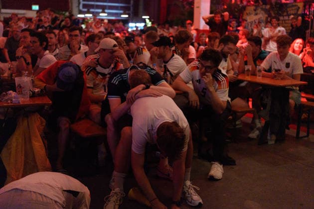 German Fans Watch Final World Cup Match at Public Viewing Germany - Munich, 30.06.2026 Spectators leaning desperately on each other, as football fans watch Germanys FIFA World Cup 2026 Round of 32 match against Paraguay during a public viewing event at the Backstage Kulturzentrum in Munich. Germany was eliminated after a 1 1 draw and a 4 3 penalty shootout defeat, ending its World Cup campaign. Bavaria