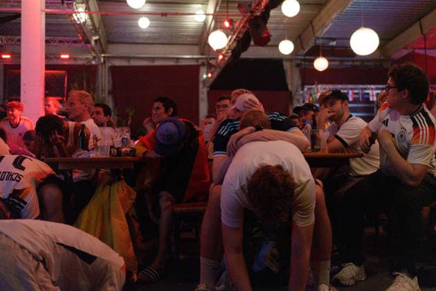 German Fans Watch Final World Cup Match at Public Viewing Germany - Munich, 30.06.2026 Spectators leaning desperately on each other, as football fans watch Germanys FIFA World Cup 2026 Round of 32 match against Paraguay during a public viewing event at the Backstage Kulturzentrum in Munich. Germany was eliminated after a 1 1 draw and a 4 3 penalty shootout defeat, ending its World Cup campaign. Bavaria
