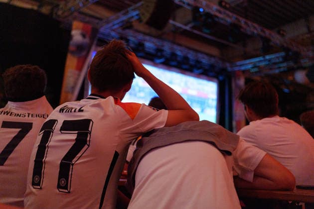German Fans Watch Final World Cup Match at Public Viewing Germany - Munich, 30.06.2026 Spectators leaning desperately on each other, as football fans watch Germanys FIFA World Cup 2026 Round of 32 match against Paraguay during a public viewing event at the Backstage Kulturzentrum in Munich. Germany was eliminated after a 1 1 draw and a 4 3 penalty shootout defeat, ending its World Cup campaign. Bavaria