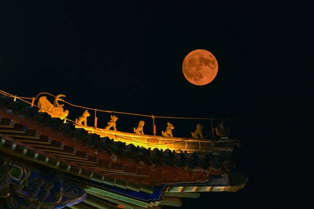 QINGZHOU, CHINA - JUNE 29: (EDITOR S NOTE: Image taken with double exposure) June s full moon, nicknamed the strawberry moon, lights up the night sky on June 29, 2026 in Qingzhou, Shandong Province of China.  Copyright: xVCGx 111651327435