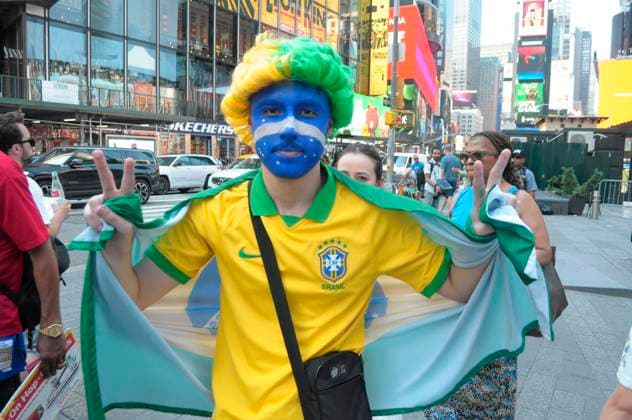 June 29, 2026, New York, United States: A fan of the Brazilian soccer team covered in face paint holds a Brazilian flag in Times Square, Manhattan, New York City. New York United States  - ZUMAs197 20260629_aaa_s197_143 Copyright: xJiminxKimx
