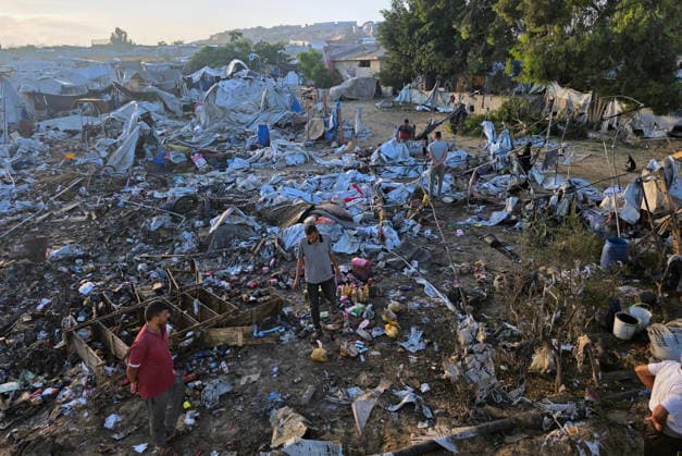 Displaced Families Inspect Damage After Israeli Airstrike in al-Mawasi Palestinian displaced families inspect damage to their tents and belongings following an Israeli airstrike that targeted a camp for displaced people in the al-Mawasi area of Khan Younis, southern Gaza Strip, on June 30, 2026. The Israeli army carried out the strike despite a ceasefire, causing extensive damage across the area. Photo by Tariq Mohammad APA Images Khan Yunis Gaza Strip Palestinian Territory 300626_Khan_Yunis_TM_00(4) Copyright: xapaimagesxTariqxMohammad xapaimagesx