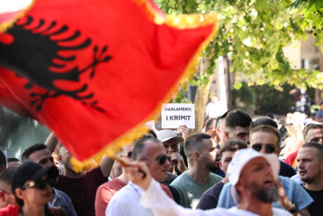 June 30, 2026, Tirana, Tirana, Albania: Protesters shout anti Government slogans as hold a sign reading Parliament of Crime during a protest in front of Albanian Parliament asking resignation of Albanian Prime Minister Edi Rama and of his Government here in Tirana, Albania, on 30 June 2026. Tirana Albania  - ZUMAb266 20260630_zip_b266_004 Copyright: xArmandoxBabanix