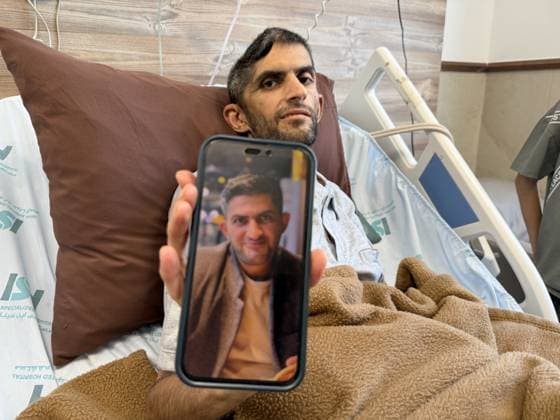 Palestinian journalist recalls life after brain hemorrhage following Israeli detention JENIN, WEST BANK, PALESTINE – JUNE 30: Palestinian journalist Mujahid Bani Muflih displays a photo of himself taken before his detention while receiving medical treatment at Ibn Sina Hospital in Jenin, West Bank, on June 30, 2026. Muflih, who says he was held in an Israeli prison for six months without charge and subjected to abuse during his detention, underwent surgery after suffering a brain hemorrhage following his release. He spoke to Anadolu about his detention and ongoing recovery. Moiz Salhi Anadolu Ramallah West Bank. Editorial use only. Please get in touch for any other usage.  Copyright: x2026xAnadoluxMoizxSalhix