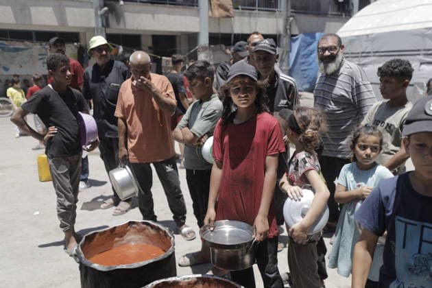 Hot meals distributed to Palestinians in Gaza GAZA CITY, GAZA, PALESTINE - JUNE 30: Hot meals are being distributed at a school sheltering Palestinians in the Rimal neighborhood, west of Gaza City, Gaza, Palestine, on June 30, 2026. Food shortages continue in the Gaza Strip due to Israel’s blockade and restrictions on the entry of humanitarian aid. Large crowds, including many children, gathered at the distribution point to receive hot meals. Ahmed Jihad Ibrahim Al-arini Anadolu Gaza City Gaza. Editorial use only. Please get in touch for any other usage.  Copyright: x2026xAnadoluxAhmedxJihadxIbrahimxAl-arinix