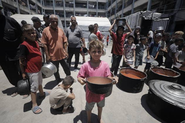 Hot meals distributed to Palestinians in Gaza GAZA CITY, GAZA, PALESTINE - JUNE 30: Hot meals are being distributed at a school sheltering Palestinians in the Rimal neighborhood, west of Gaza City, Gaza, Palestine, on June 30, 2026. Food shortages continue in the Gaza Strip due to Israel’s blockade and restrictions on the entry of humanitarian aid. Large crowds, including many children, gathered at the distribution point to receive hot meals. Ahmed Jihad Ibrahim Al-arini Anadolu Gaza City Gaza. Editorial use only. Please get in touch for any other usage.  Copyright: x2026xAnadoluxAhmedxJihadxIbrahimxAl-arinix