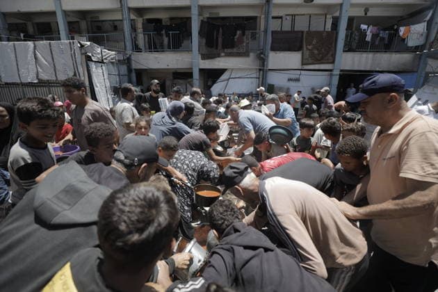 Hot meals distributed to Palestinians in Gaza GAZA CITY, GAZA, PALESTINE - JUNE 30: Hot meals are being distributed at a school sheltering Palestinians in the Rimal neighborhood, west of Gaza City, Gaza, Palestine, on June 30, 2026. Food shortages continue in the Gaza Strip due to Israel’s blockade and restrictions on the entry of humanitarian aid. Large crowds, including many children, gathered at the distribution point to receive hot meals. Ahmed Jihad Ibrahim Al-arini Anadolu Gaza City Gaza. Editorial use only. Please get in touch for any other usage.  Copyright: x2026xAnadoluxAhmedxJihadxIbrahimxAl-arinix