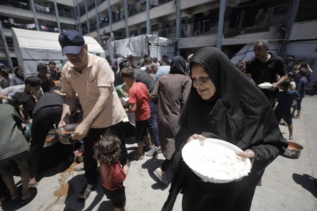 Hot meals distributed to Palestinians in Gaza GAZA CITY, GAZA, PALESTINE - JUNE 30: Hot meals are being distributed at a school sheltering Palestinians in the Rimal neighborhood, west of Gaza City, Gaza, Palestine, on June 30, 2026. Food shortages continue in the Gaza Strip due to Israel’s blockade and restrictions on the entry of humanitarian aid. Large crowds, including many children, gathered at the distribution point to receive hot meals. Ahmed Jihad Ibrahim Al-arini Anadolu Gaza City Gaza. Editorial use only. Please get in touch for any other usage.  Copyright: x2026xAnadoluxAhmedxJihadxIbrahimxAl-arinix