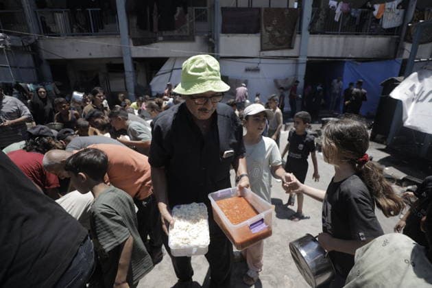 Hot meals distributed to Palestinians in Gaza GAZA CITY, GAZA, PALESTINE - JUNE 30: Hot meals are being distributed at a school sheltering Palestinians in the Rimal neighborhood, west of Gaza City, Gaza, Palestine, on June 30, 2026. Food shortages continue in the Gaza Strip due to Israel’s blockade and restrictions on the entry of humanitarian aid. Large crowds, including many children, gathered at the distribution point to receive hot meals. Ahmed Jihad Ibrahim Al-arini Anadolu Gaza City Gaza. Editorial use only. Please get in touch for any other usage.  Copyright: x2026xAnadoluxAhmedxJihadxIbrahimxAl-arinix