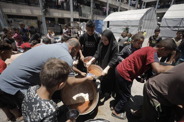 Hot meals distributed to Palestinians in Gaza GAZA CITY, GAZA, PALESTINE - JUNE 30: Hot meals are being distributed at a school sheltering Palestinians in the Rimal neighborhood, west of Gaza City, Gaza, Palestine, on June 30, 2026. Food shortages continue in the Gaza Strip due to Israel’s blockade and restrictions on the entry of humanitarian aid. Large crowds, including many children, gathered at the distribution point to receive hot meals. Ahmed Jihad Ibrahim Al-arini Anadolu Gaza City Gaza. Editorial use only. Please get in touch for any other usage.  Copyright: x2026xAnadoluxAhmedxJihadxIbrahimxAl-arinix
