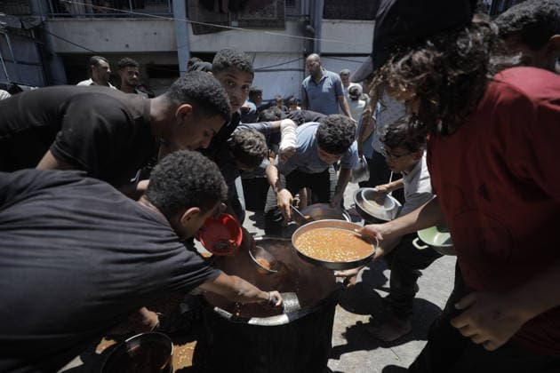 Hot meals distributed to Palestinians in Gaza GAZA CITY, GAZA, PALESTINE - JUNE 30: Hot meals are being distributed at a school sheltering Palestinians in the Rimal neighborhood, west of Gaza City, Gaza, Palestine, on June 30, 2026. Food shortages continue in the Gaza Strip due to Israel’s blockade and restrictions on the entry of humanitarian aid. Large crowds, including many children, gathered at the distribution point to receive hot meals. Ahmed Jihad Ibrahim Al-arini Anadolu Gaza City Gaza. Editorial use only. Please get in touch for any other usage.  Copyright: x2026xAnadoluxAhmedxJihadxIbrahimxAl-arinix