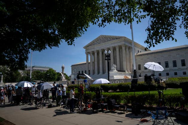 News anchors are seen outside the Supreme Court of the United States in Washington, DC as the court releases their final opinions before summer recess on Tuesday, June 30, 2026. The court upheld birthright citizenship, and also state laws banning transgender women and girls from playing on school athletic teams.  WAP20260630431 BONNIExCASH