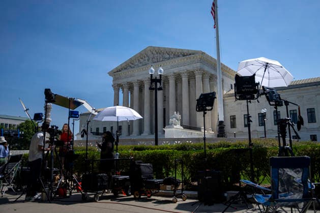 News anchors are seen outside the Supreme Court of the United States in Washington, DC as the court releases their final opinions before summer recess on Tuesday, June 30, 2026. The court upheld birthright citizenship, and also state laws banning transgender women and girls from playing on school athletic teams.  WAP20260630432 BONNIExCASH