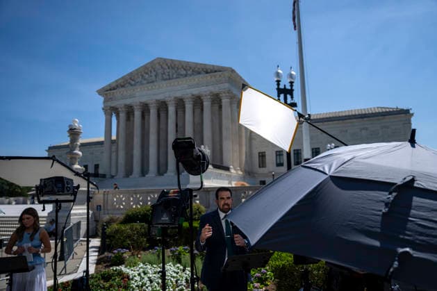 News anchors are seen outside the Supreme Court of the United States in Washington, DC as the court releases their final opinions before summer recess on Tuesday, June 30, 2026. The court upheld birthright citizenship, and also state laws banning transgender women and girls from playing on school athletic teams.  WAP20260630433 BONNIExCASH