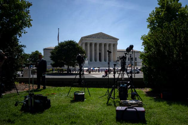 News teams set up outside the Supreme Court of the United States in Washington, DC as the court releases their final opinions before summer recess on Tuesday, June 30, 2026. The court upheld birthright citizenship, and also state laws banning transgender women and girls from playing on school athletic teams.  WAP20260630435 BONNIExCASH