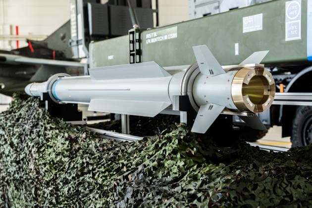 Kaufbeuren, Bavaria, Germany - June 30, 2026: Kaufbeuren Air Base, the Bundeswehr, and the German Air Force: The Future of the Arrow Weapon System for Germany (AWS-G), Air Defense, Military Base, and Pilot Project for Historic Preservation. IRIS-T SL guided missile (inert display model) in front of a transport and storage container for the ground-based IRIS-T SLM air defense system *** Fliegerhorst Kaufbeuren, Bundeswehr und Luftwaffe: Zukunft des Arrow Weapon System for Germany (AWS-G), Luftverteidigung, Militärstandort und Pilotvorhaben Denkmalschutz. IRIS-T SL-Lenkflugkörper (inertes Ausstellungsmodell) vor einem Transport- und Lagerbehälter des bodengebundenen Luftverteidigungssystems IRIS-T SLM