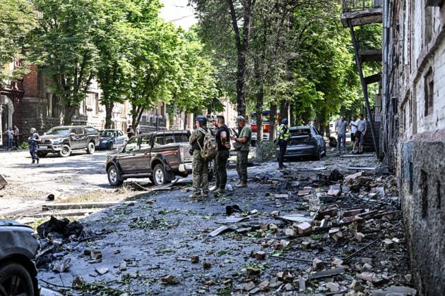 A law enforcer and EOD experts stand in the street, covered with rubble, outside buildings damaged by a Russian drone strike, Zaporizhzhia, Ukraine, June 30, 2026. On Tuesday, June 30, a Russian drone struck Zaporizhzhia, hitting the historic part of the city and damaging cultural heritage sites of local importance. The blast wave damaged cars, the Leshchynskyi House, the Zaporizhzhia Choral Synagogue (Leshchynskyi Synagogue), and the Pashutin family house. (Photo by Dmytro Smolienko Ukrinform) Russian attack historical centre of Zaporizhzhia with drone  Copyright: xDmytroxSmolienkox