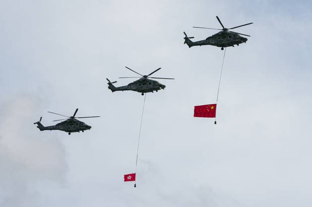 HONG KONG-DAILY HKSAR-ANNIVERSARY Helicopters from the Government Flying Service carrying the national and regional flags fly past Victoria Harbour to mark the 29th anniversary of the establishment of the HKSAR during the flag-raising ceremony on July 1, 2026 in Hong Kong. (Photo by Kevin Li TMHK via Nexpher Images) Hong Kong