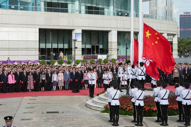 HONG KONG-DAILY HKSAR-ANNIVERSARY Members of the flag party raise the national and regional flags during the ceremony marking the 29th anniversary of the establishment of the HKSAR at Golden Bauhinia Square on July 1, 2026 in Hong Kong. (Photo by Kevin Li TMHK via Nexpher Images) Hong Kong