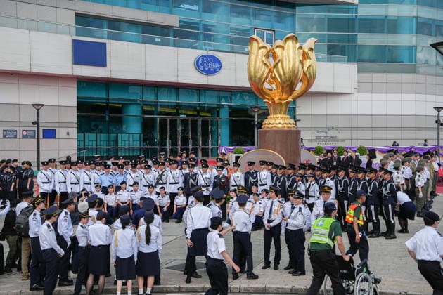 HONG KONG-DAILY HKSAR-ANNIVERSARY Commissioner of Police Chau Yat-ming poses for a group photo with members of uniformed groups following the flag-raising ceremony at Golden Bauhinia Square on July 1, 2026 in Hong Kong. (Photo by Kevin Li TMHK via Nexpher Images) Hong Kong