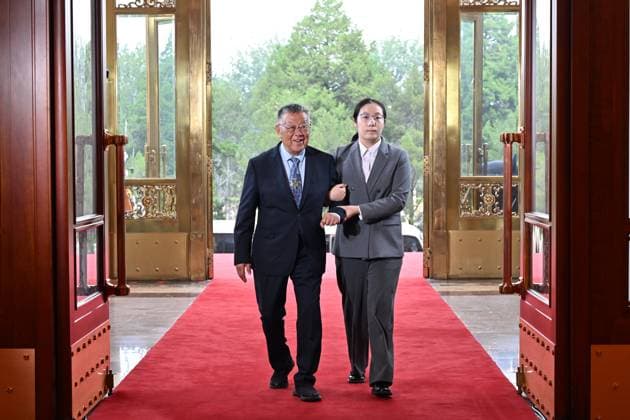 (260701) -- BEIJING, July 1, 2026 -- Zhao Yafu, recipient of the July 1 Medal, enters the Great Hall of the People in Beijing, capital of China, July 1, 2026. China will hold a gathering to celebrate the 105th founding anniversary of the Communist Party of China (CPC) at 10 a.m. Wednesday at the Great Hall of the People in Beijing. ) CHINA-BEIJING-CPC-105TH FOUNDING ANNIVERSARY-CELEBRATION (CN) YinxBogu 