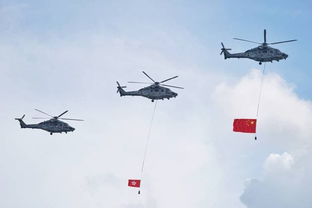 HONG KONG, CHINA - JULY 01: Helicopters carrying flags of China and Hong Kong Special Administrative Region (HKSAR) fly over Victoria Harbor during a flag-raising ceremony celebrating the 29th anniversary of Hong Kong s return to the motherland on July 1, 2026 in Hong Kong, China.  Copyright: xChinaxNewsxServicex 111651553732