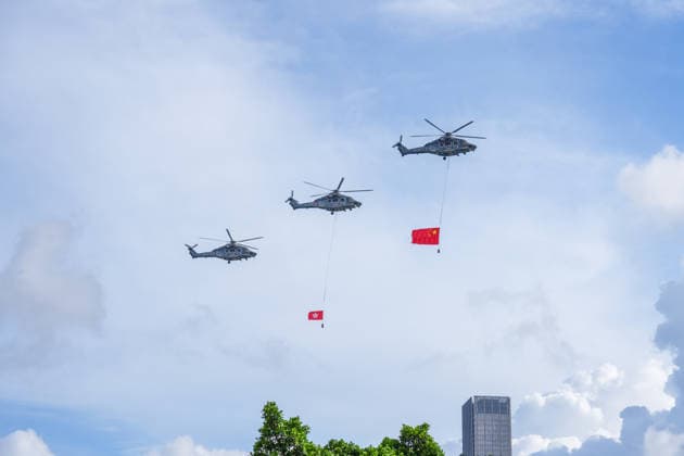 (260701) -- HONG KONG, July 1, 2026 -- Helicopters carry China s national flag and the flag of the Hong Kong Special Administrative Region (HKSAR) during a flag-raising ceremony held by the HKSAR government to celebrate the 29th anniversary of Hong Kong s return to the motherland in Hong Kong, south China, July 1, 2026. ) CHINA-HONG KONG-RETURN TO MOTHERLAND-29TH ANNIVERSARY-FLAG-RAISING CEREMONY (CN) ZhuxWei 