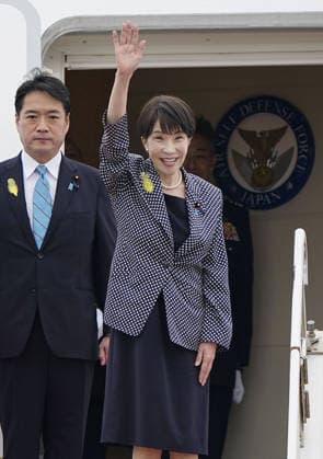 Japan PM Takaichi off to India Japanese Prime Minister Sanae Takaichi waves at Tokyo s Haneda airport on July 1, 2026, before making a three-day trip to India for a summit with Indian Prime Minister Narendra Modi.  A14AA0005621126P