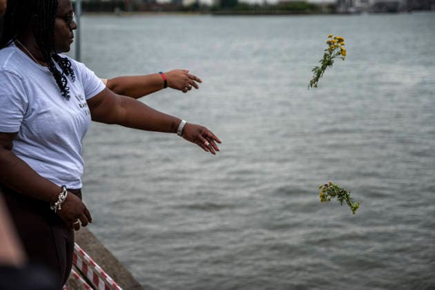June 30, 2026, Rotterdam, South Holland, Netherlands: 30 June 2026, Rotterdam, the Netherlands. Attendees throw flowers into the river Nieuwe Maas to remember the victims of the Dutch slave trade. Commemorating Keti Koti (Ã¢â‚¬oeBroken ChainsÃ¢â‚¬Â in SranantongoÃ¢â‚¬the language of Suriname), attendees gathered at the monument, Ã¢â‚¬oeClave,Ã¢â‚¬Â which commemorates the Dutch history of slavery. The ceremony marks the 163rd anniversary of the abolition of slavery in Suriname and the Dutch Caribbean. Rotterdam Netherlands - ZUMAp202 20260630_zip_p202_008 Copyright: xJamesxPetermeierx