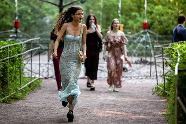 RUSSIA, ST PETERSBURG - JUNE 30, 2026: Young people attend an annual ball held at the Peterhof State Museum Reserve for school leavers awarded gold medals for academic excellence. Peter Kovalev TASS  94535114
