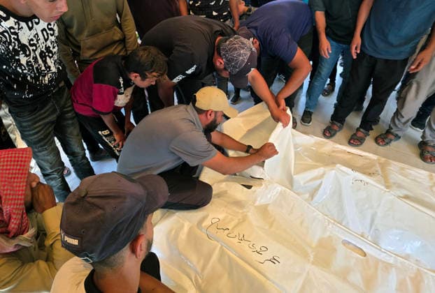 Mourners bid farewell to two Palestinians at Nasser Medical Complex Mourners bid farewell to the bodies of two Palestinians at Nasser Medical Complex in Khan Younis, southern Gaza Strip, on July 1, 2026, after they were killed in an Israeli airstrike that targeted a group of people near the Asdaa junction in the al-Mawasi area of Khan Younis the previous evening. Photo by Tariq Mohammad APA Images Khan Yunis Gaza Strip Palestinian Territory 010726_Khan_Yunis_TM_01(3) Copyright: xapaimagesxTariqxMohammad xapaimagesx