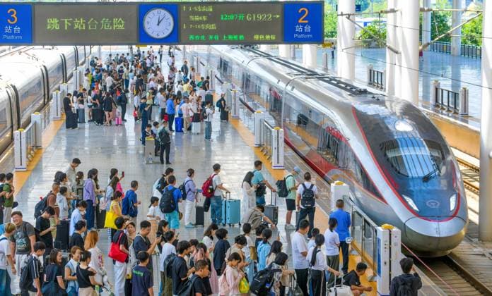LUOYANG, CHINA - JULY 01: Passengers board a Fuxing bullet train at Luoyang Longmen Railway Station on July 1, 2026 in Luoyang, Henan Province of China. China s national railway network has implemented a new train schedule to accommodate the upcoming summer travel rush.  Copyright: xVCGx 111651582411
