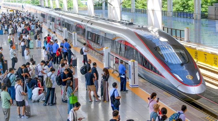 LUOYANG, CHINA - JULY 01: Passengers board a Fuxing bullet train at Luoyang Longmen Railway Station on July 1, 2026 in Luoyang, Henan Province of China. China Railway has adjusted the train operation diagram to kick off the summer transport period.  Copyright: xVCGx 111651582415