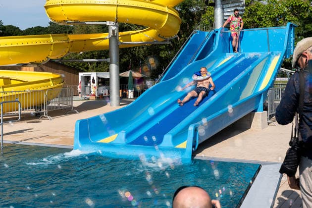 July 1, 2026, Breclav, South Moravia, Czech Republic: Breclav Mayor SVATOPLUK PECEK takes the first ride down a water slide during the reopening ceremony of the municipal outdoor swimming pool in Breclav, Czech Republic, on July 1, 2026. The outdoor facility reopened after approximately 18 months of construction as part of a CZK 530 million redevelopment project that also includes a new indoor swimming pool scheduled for completion in early 2027. Breclav Czech Republic - ZUMAc315 20260701_zsp_c315_015 Copyright: xMichaelxCabalx
