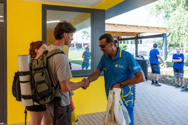 July 1, 2026, Breclav, South Moravia, Czech Republic: David Bartal, a representative of Tereza Breclav, welcomes the first visitors and presents them with gift bags during the reopening of the municipal outdoor swimming pool in Breclav, Czech Republic, on July 1, 2026. The outdoor facility reopened after approximately 18 months of reconstruction as part of a CZK 530 million redevelopment project that also includes a new indoor swimming pool scheduled for completion in early 2027. Breclav Czech Republic - ZUMAc315 20260701_zsp_c315_020 Copyright: xMichaelxCabalx