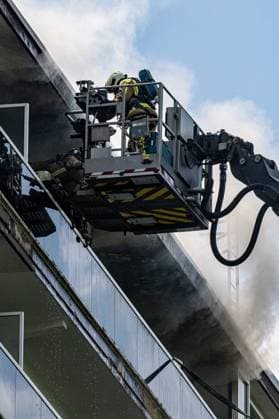Firefighters pictured at the scene of a fire in an apartment building in the August Vermeylenlaan street in Antwerp on Wednesday 01 July 2026. According to the first information the fire broke out on the eighth level of the 10-floor building.  JONASxROOSENS 180079735