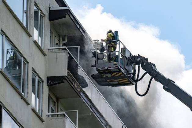 Firefighters pictured at the scene of a fire in an apartment building in the August Vermeylenlaan street in Antwerp on Wednesday 01 July 2026. According to the first information the fire broke out on the eighth level of the 10-floor building.  JONASxROOSENS 180079966