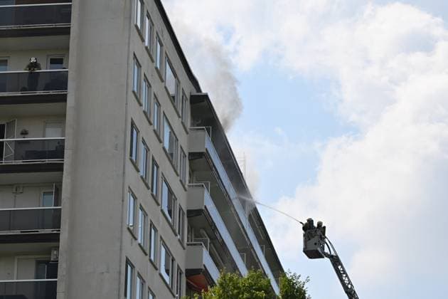 (260701) -- ANTWERP, July 1, 2026 -- Firefighters try to extinguish a fire in an apartment building in Antwerp, Belgium, July 1, 2026. Several people died and others were seriously injured or affected by smoke after a major fire broke out on Wednesday morning in an apartment building in the Belgian port city of Antwerp. Firefighters were still searching for possible victims inside the building. (JONAS ROOSENS BELGA PHOTO Handout via Xinhua) (SpotNews) BELGIUM-ANTWERP-APARTMENT BUILDING-FIRE LvxYou 