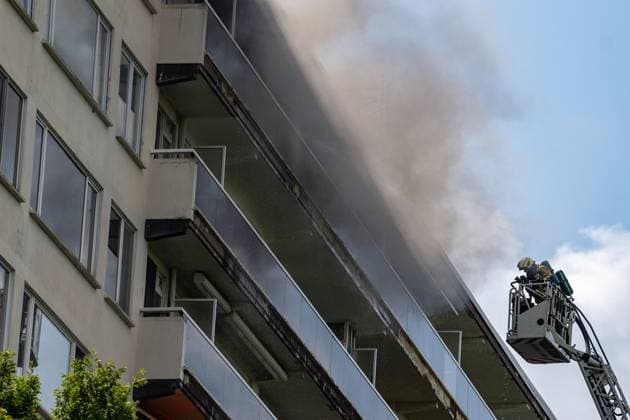 Firefighters pictured at the scene of a fire in an apartment building in the August Vermeylenlaan street in Antwerp on Wednesday 01 July 2026. According to the first information the fire broke out on the eighth level of the 10-floor building.  JONASxROOSENS 180080017