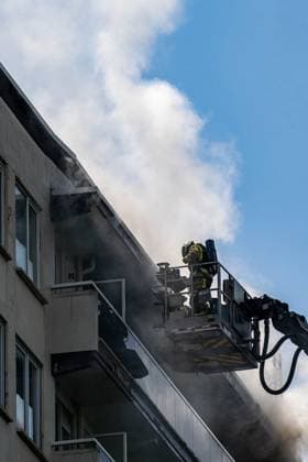 Firefighters pictured at the scene of a fire in an apartment building in the August Vermeylenlaan street in Antwerp on Wednesday 01 July 2026. According to the first information the fire broke out on the eighth level of the 10-floor building.  JONASxROOSENS 180080138