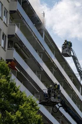 Firefighters pictured at the scene of a fire in an apartment building in the August Vermeylenlaan street in Antwerp on Wednesday 01 July 2026. According to the first information the fire broke out on the eighth level of the 10-floor building.  JONASxROOSENS 180080294