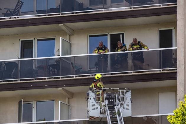 Firefighters pictured at the scene of a fire in an apartment building in the August Vermeylenlaan street in Antwerp on Wednesday 01 July 2026. According to the first information the fire broke out on the eighth level of the 10-floor building.  JONASxROOSENS 180080788